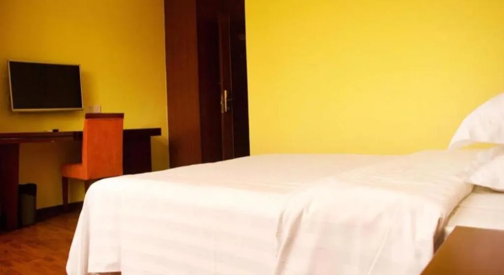 Bed in Eurasia International Hotel