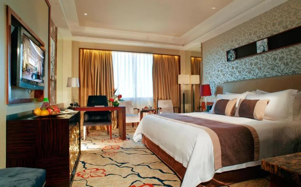 Bed in Eurasia International Hotel