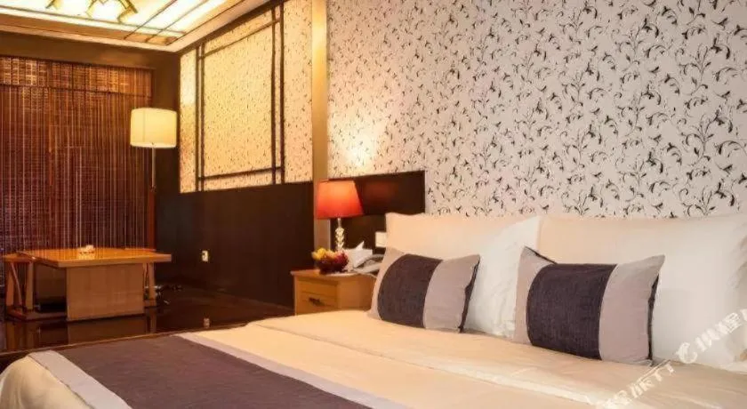 Bed in Eurasia International Hotel