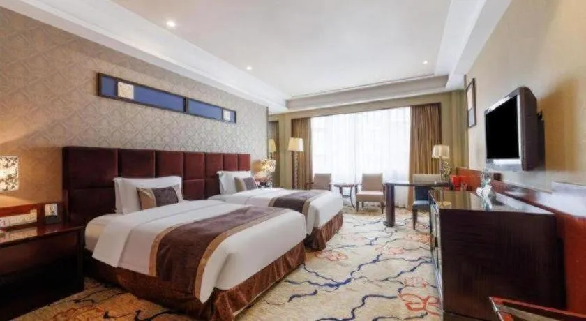 Bed in Eurasia International Hotel