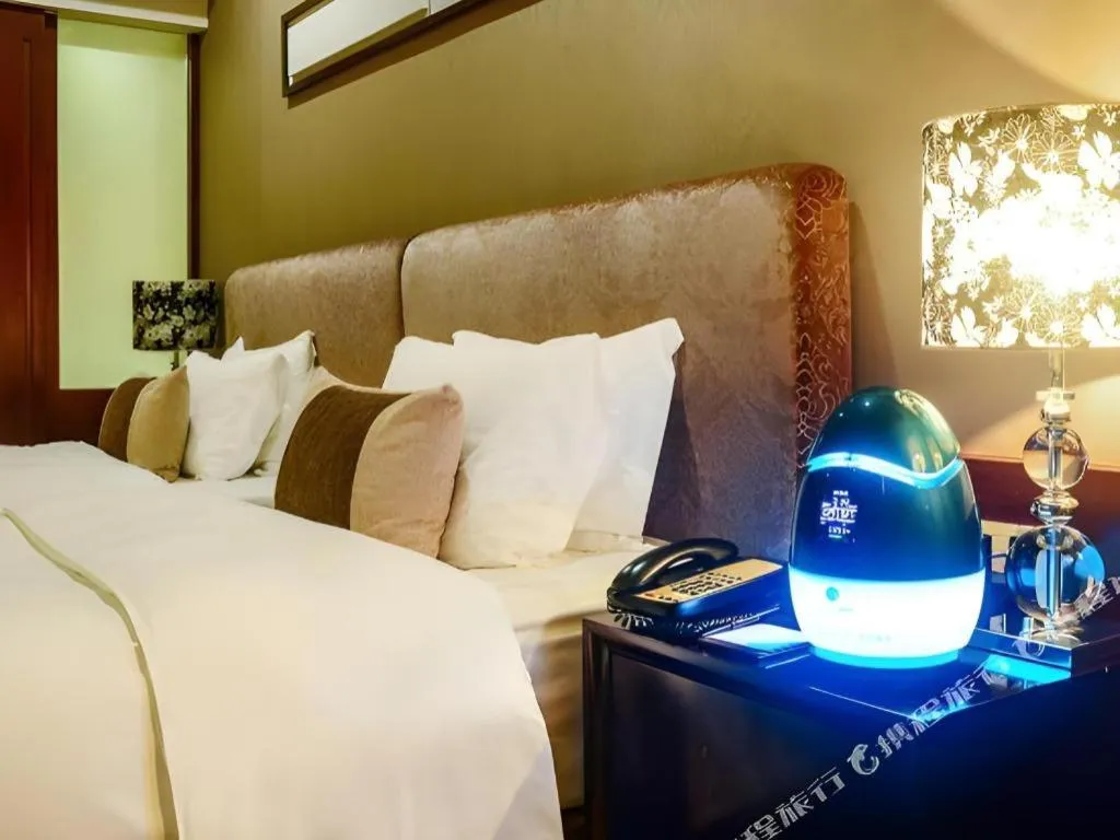 Bed in Eurasia International Hotel