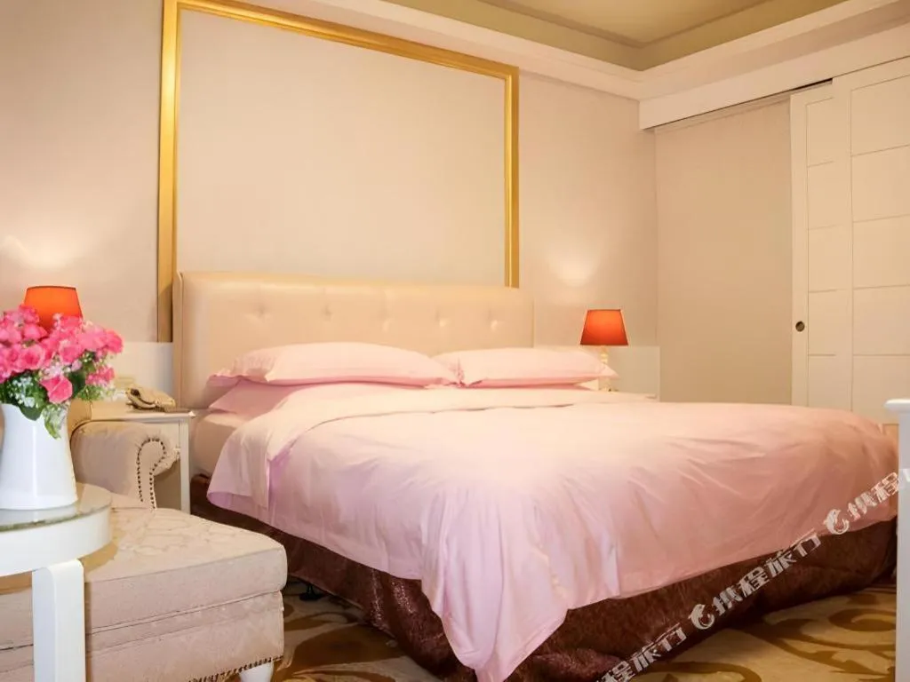 Bed in Eurasia International Hotel