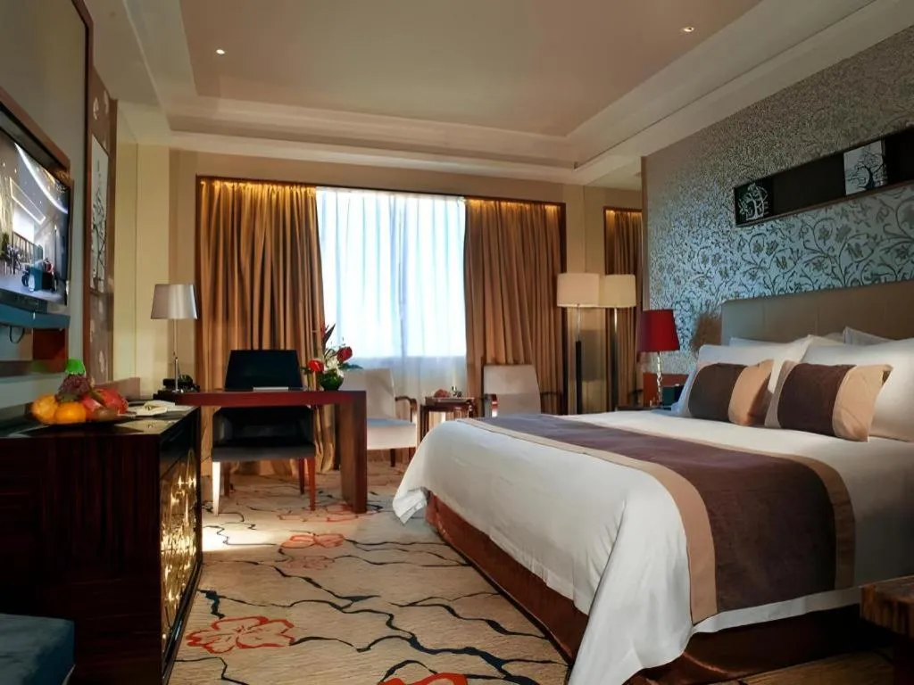 Bed in Eurasia International Hotel