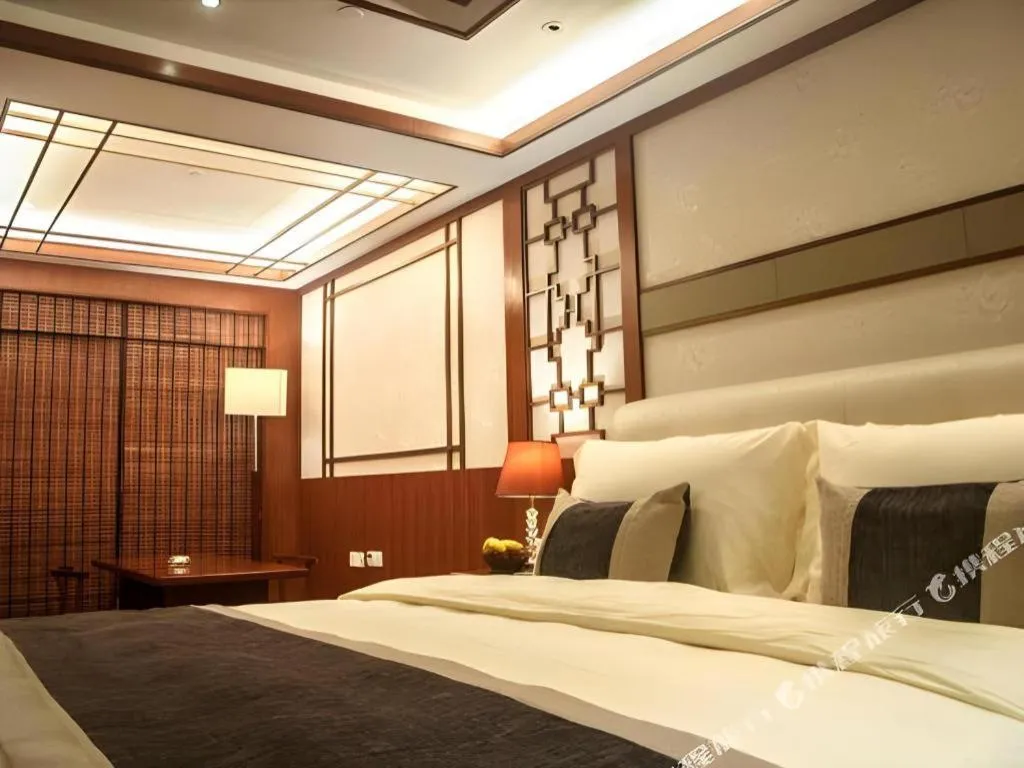 Bed in Eurasia International Hotel