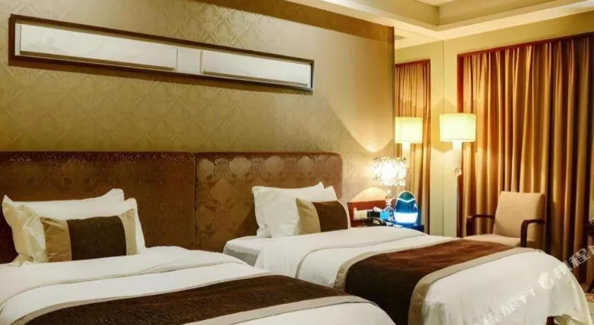 Bed in Eurasia International Hotel