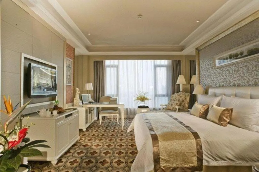 Bed in Eurasia International Hotel