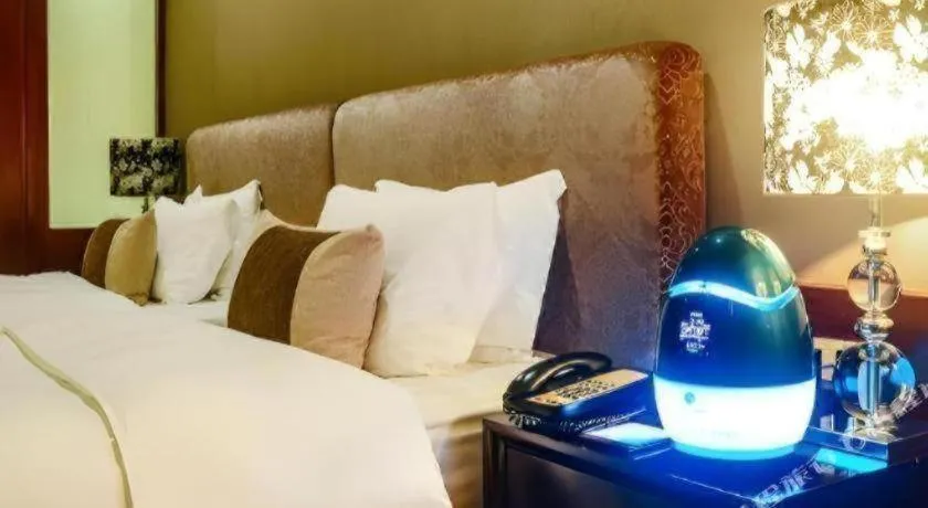 Bed in Eurasia International Hotel