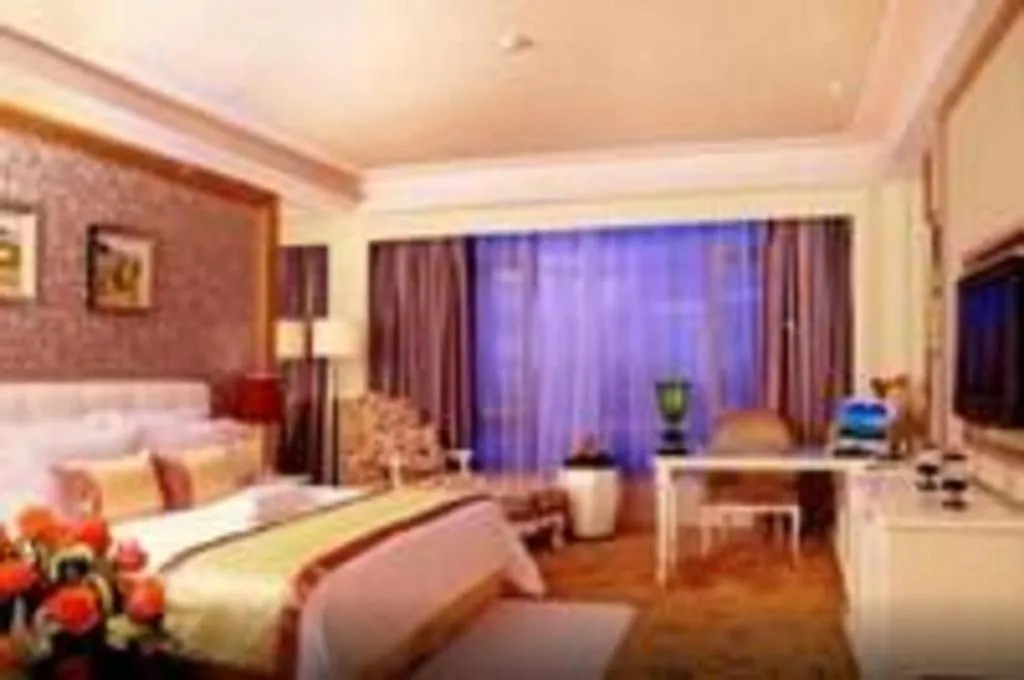 Bed in Eurasia International Hotel