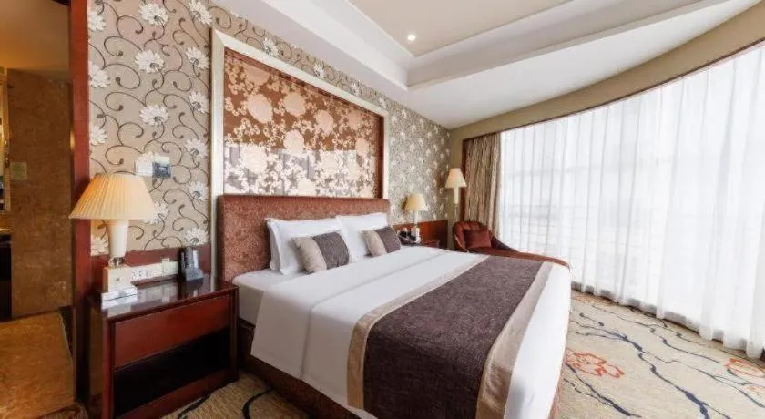 Bed in Eurasia International Hotel