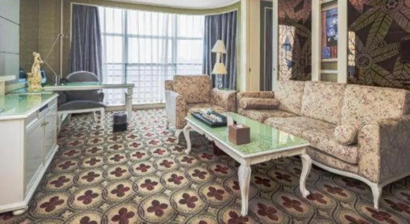 Bed in Eurasia International Hotel