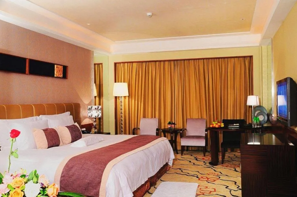 Bed in Eurasia International Hotel