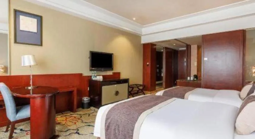 Bed in Eurasia International Hotel