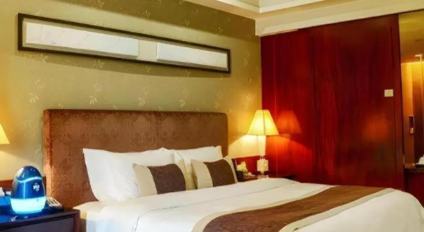 Bed in Eurasia International Hotel