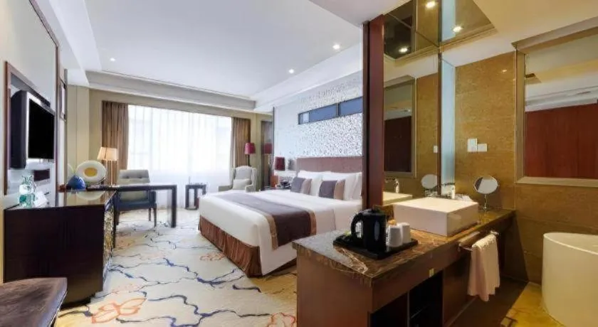 Bed in Eurasia International Hotel