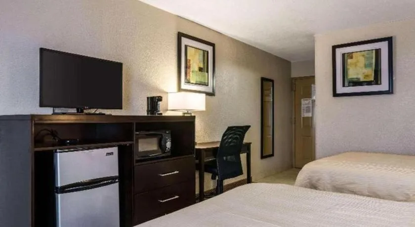 Bed in Quality Inn & Suites