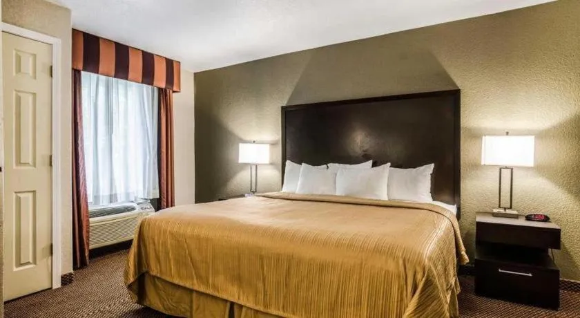 Bed in Quality Inn & Suites