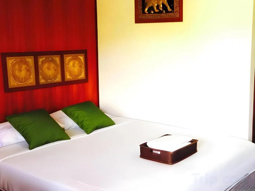 Bed in Chiangsan Goldenland Resort