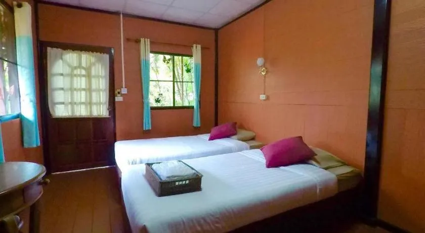 Bed in Chiangsan Goldenland Resort