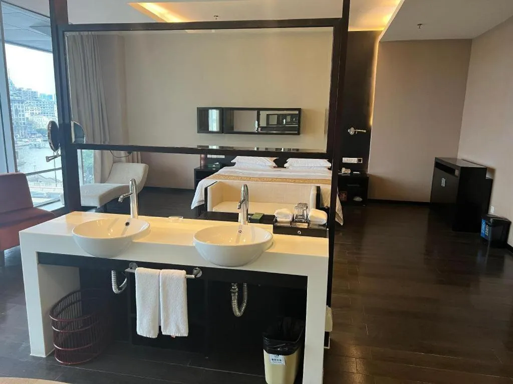 Bed in Guangdong Nanmei Osotto Hotel