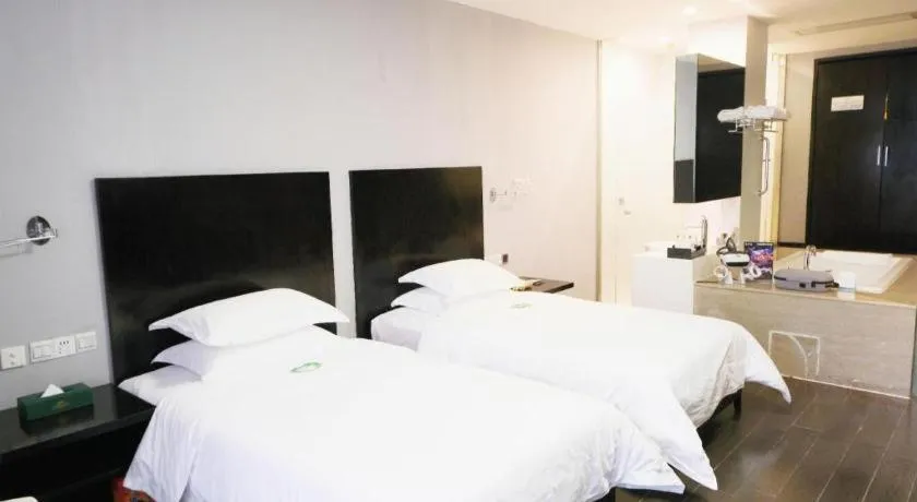 Bed in Guangdong Nanmei Osotto Hotel