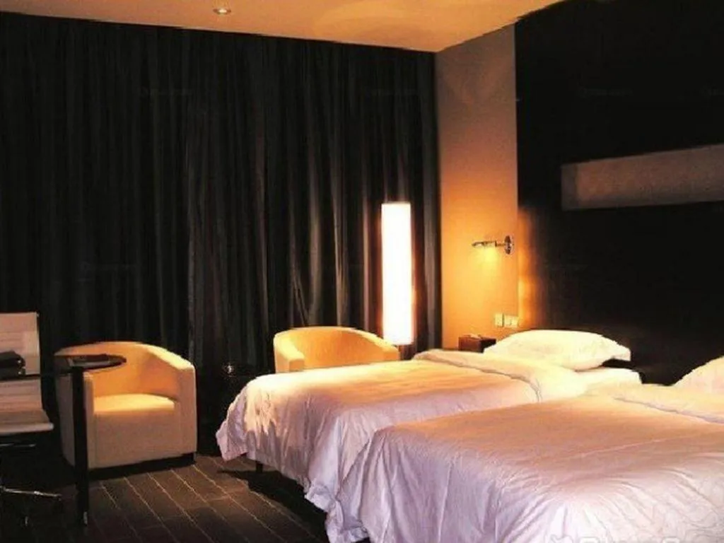 Bed in Guangdong Nanmei Osotto Hotel