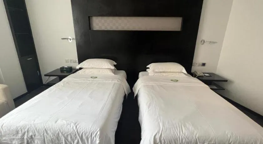 Bed in Guangdong Nanmei Osotto Hotel