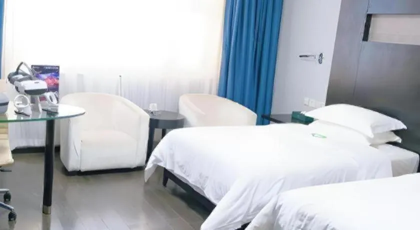 Bed in Guangdong Nanmei Osotto Hotel