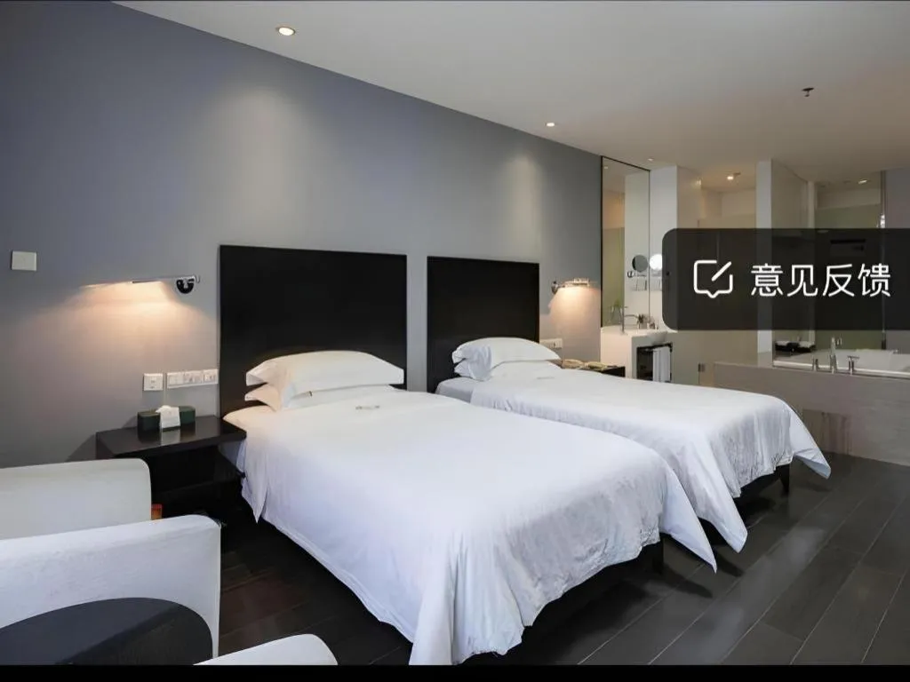 Bed in Guangdong Nanmei Osotto Hotel