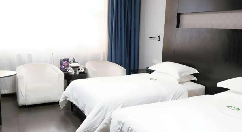 Bed in Guangdong Nanmei Osotto Hotel