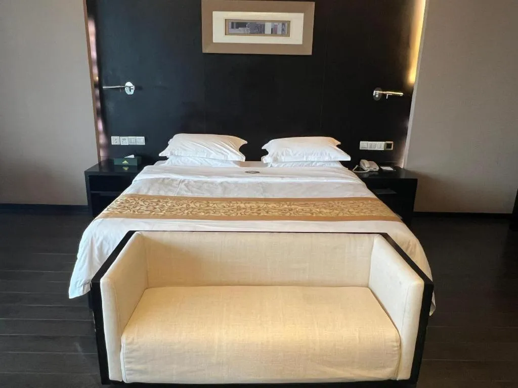 Bed in Guangdong Nanmei Osotto Hotel