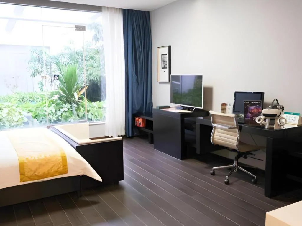 Bed in Guangdong Nanmei Osotto Hotel