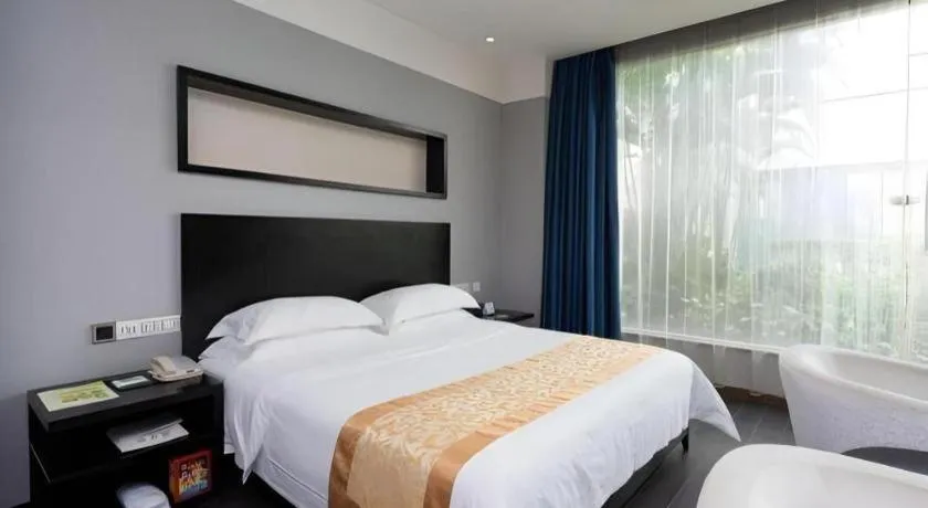 Bed in Guangdong Nanmei Osotto Hotel