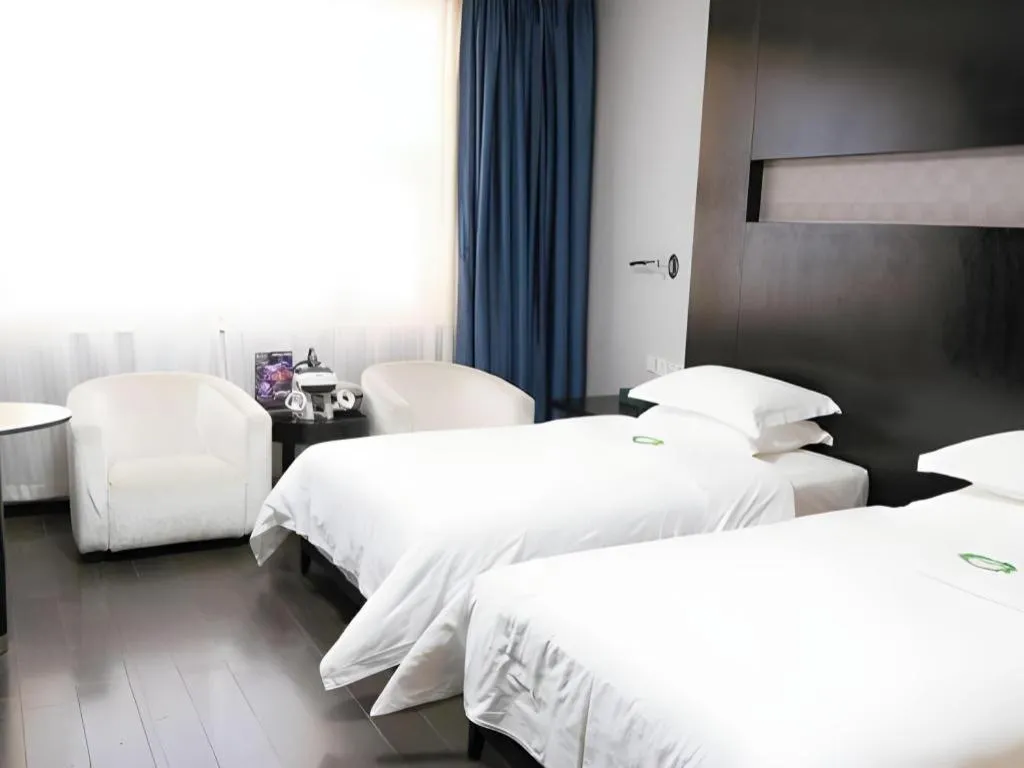 Bed in Guangdong Nanmei Osotto Hotel