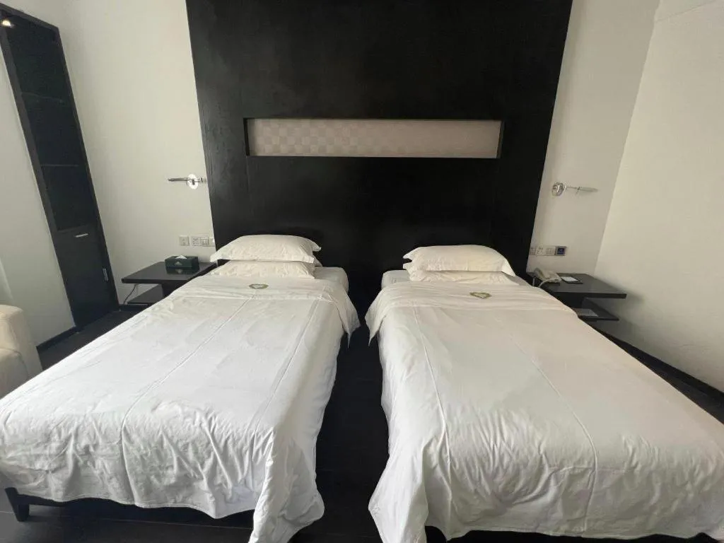 Bed in Guangdong Nanmei Osotto Hotel