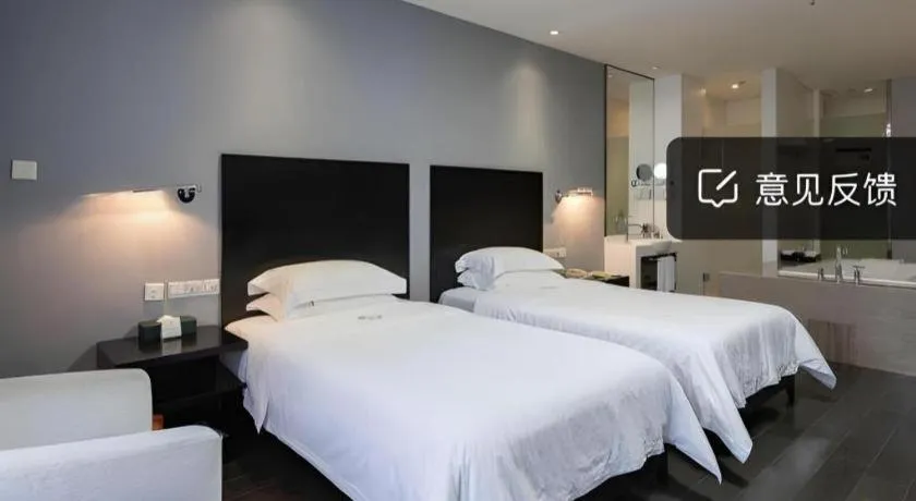 Bed in Guangdong Nanmei Osotto Hotel