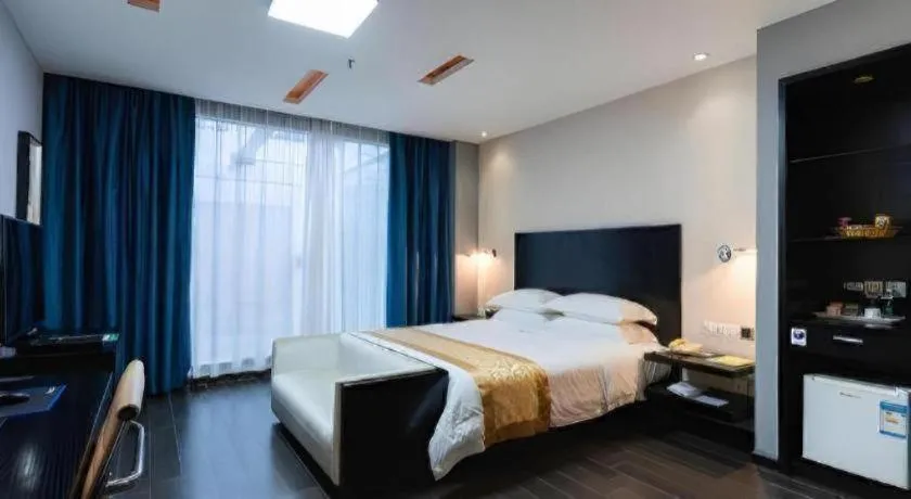 Bed in Guangdong Nanmei Osotto Hotel