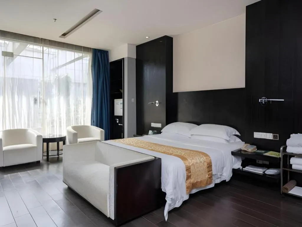 Bed in Guangdong Nanmei Osotto Hotel