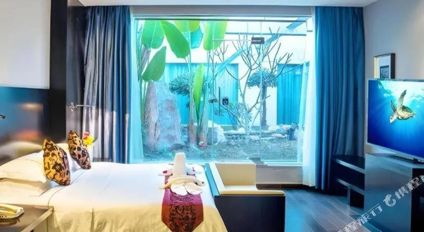 Bed in Guangdong Nanmei Osotto Hotel