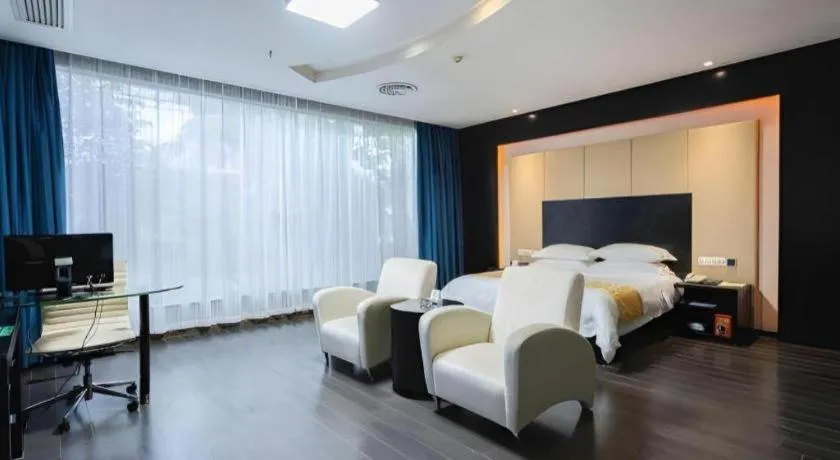 Bed in Guangdong Nanmei Osotto Hotel