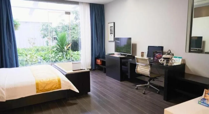 Bed in Guangdong Nanmei Osotto Hotel