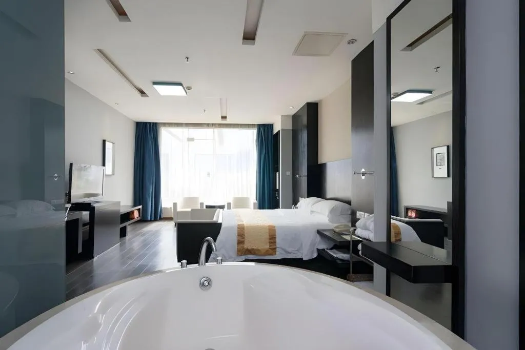 Bed in Guangdong Nanmei Osotto Hotel