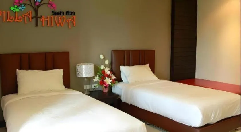 Bed in Villa Thiwa Hotel