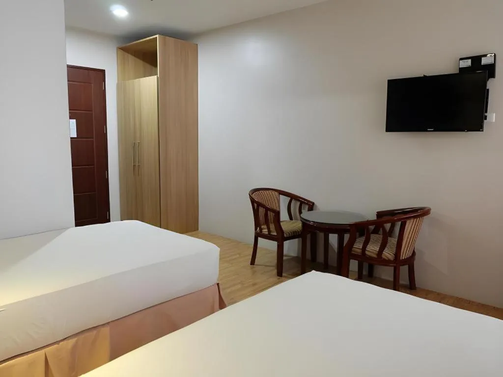 Bed in Capitol Central Hotel and Suites