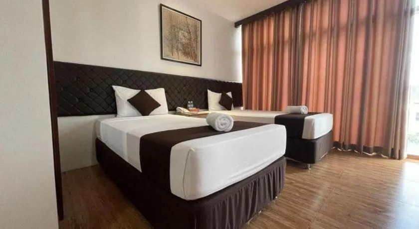 Bed in Capitol Central Hotel and Suites