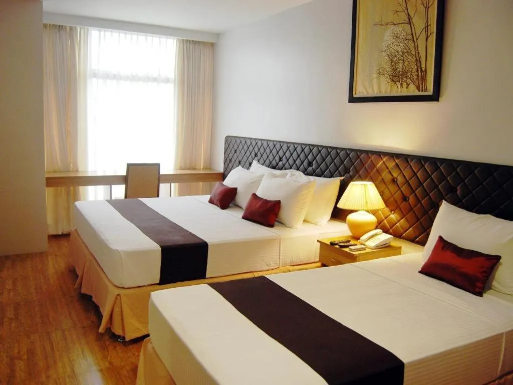 Bed in Capitol Central Hotel and Suites