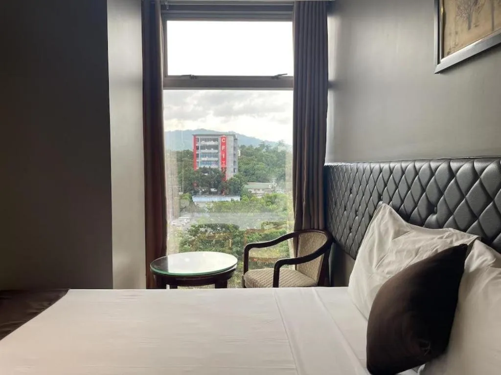 Bed in Capitol Central Hotel and Suites