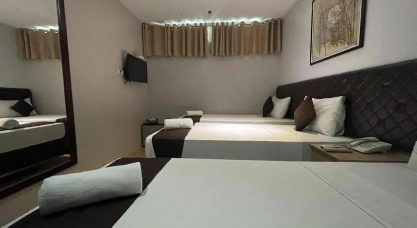 Bed in Capitol Central Hotel and Suites