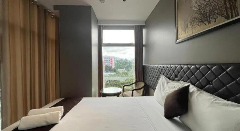 Bed in Capitol Central Hotel and Suites