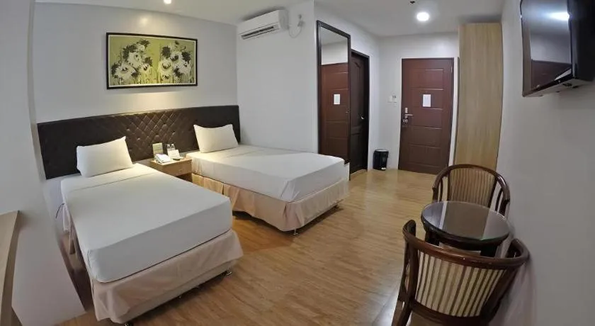 Bed in Capitol Central Hotel and Suites