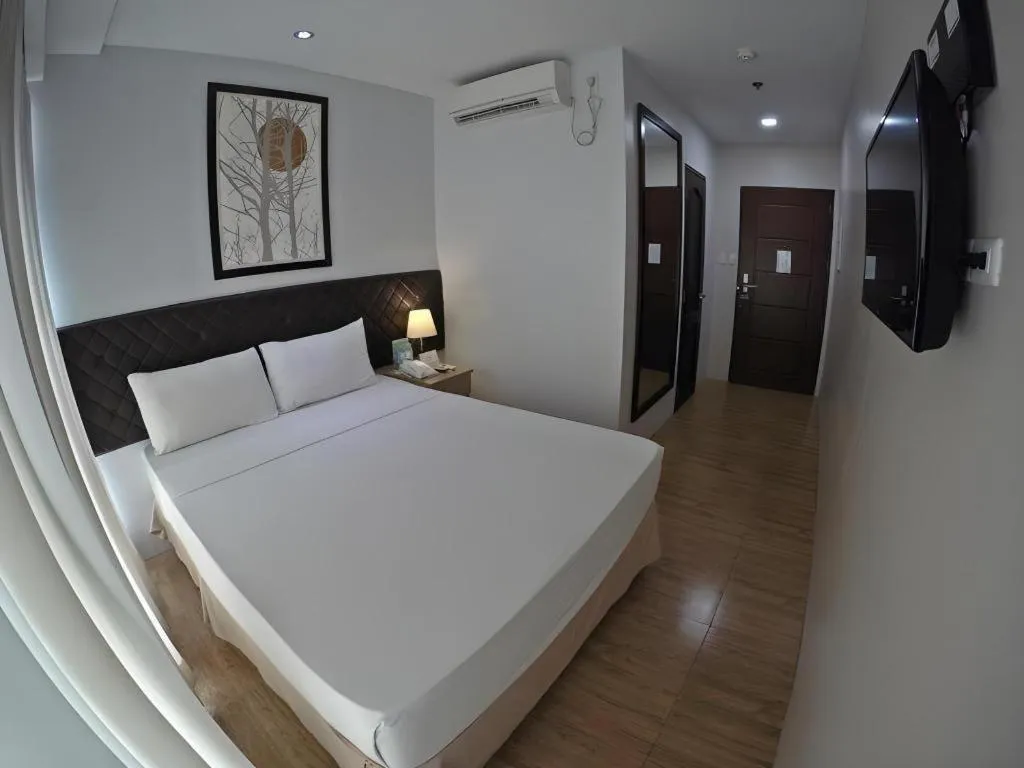 Bed in Capitol Central Hotel and Suites